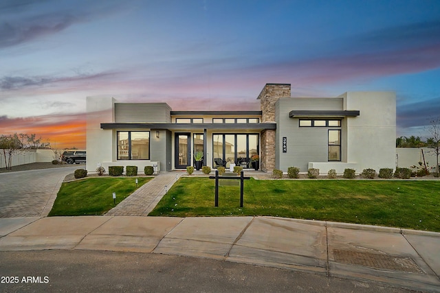 contemporary house featuring a lawn