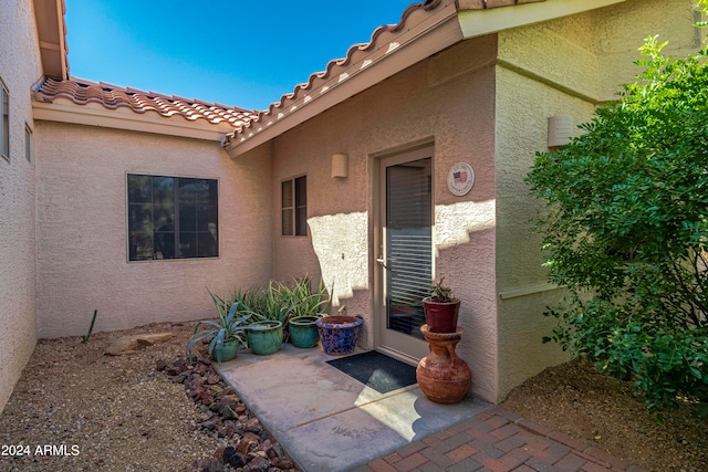 doorway to property featuring a patio