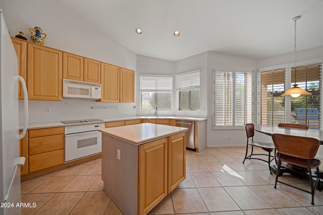 kitchen with white appliances, vaulted ceiling, plenty of natural light, and a center island