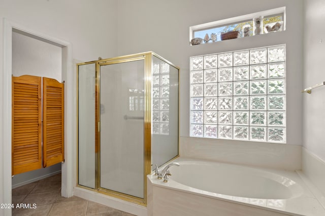 bathroom featuring shower with separate bathtub and tile patterned floors