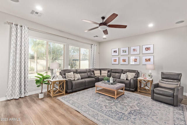 living area featuring visible vents, wood finished floors, recessed lighting, baseboards, and ceiling fan