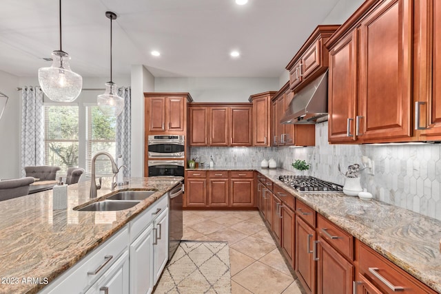 kitchen featuring light stone countertops, a sink, decorative backsplash, stainless steel appliances, and under cabinet range hood