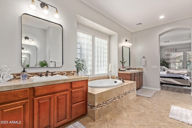 full bath with a sink, visible vents, plenty of natural light, and tile patterned flooring