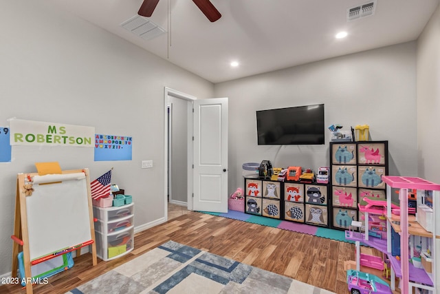 playroom with a ceiling fan, recessed lighting, wood finished floors, and visible vents