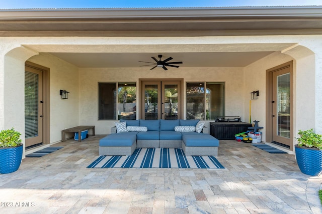 view of patio featuring an outdoor living space and a ceiling fan