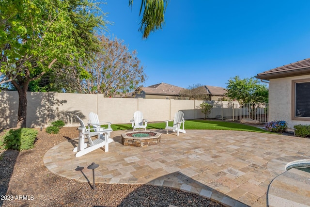 view of patio / terrace featuring a fenced backyard and an outdoor fire pit