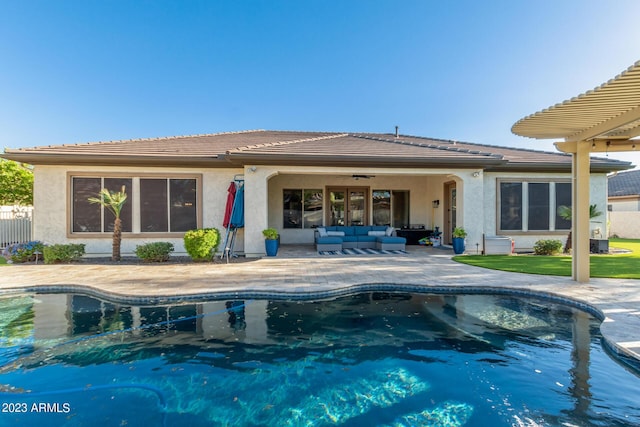 pool with a patio area, an outdoor hangout area, and ceiling fan