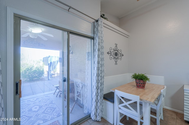 interior space with ceiling fan and light tile patterned flooring