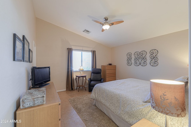 tiled bedroom featuring vaulted ceiling and ceiling fan