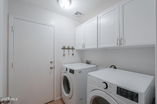 laundry area featuring cabinets and independent washer and dryer