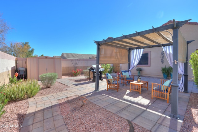 view of patio featuring a pergola, a grill, an outdoor living space, and a storage unit