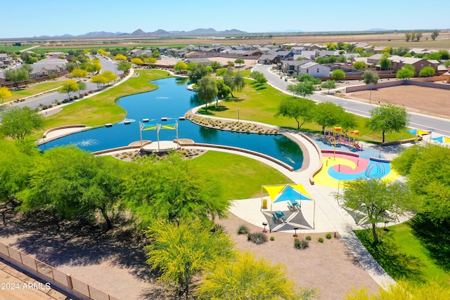 aerial view featuring a water and mountain view