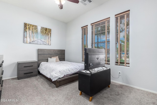 bedroom featuring light carpet and ceiling fan