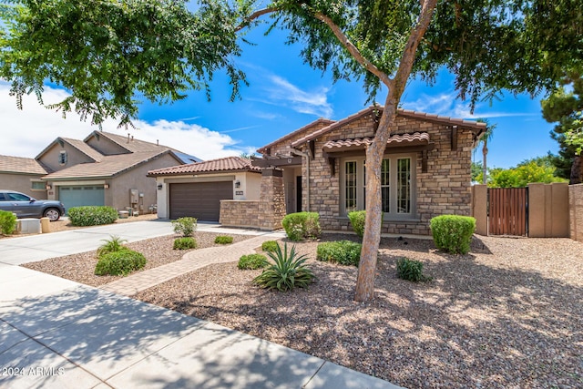 view of front of property with a garage