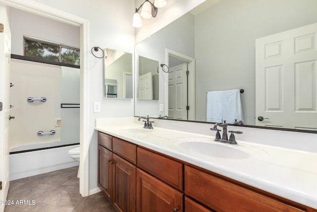 full bathroom featuring tile patterned floors, toilet, vanity, and combined bath / shower with glass door