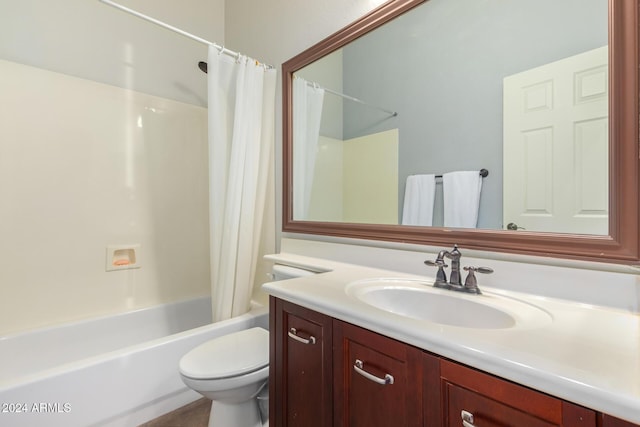 full bathroom featuring shower / tub combo, vanity, and toilet