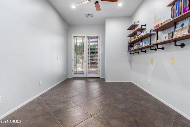 unfurnished room with ceiling fan