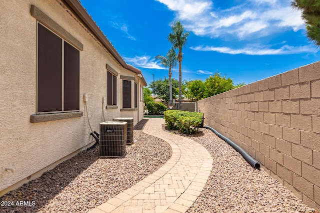 view of yard with central AC