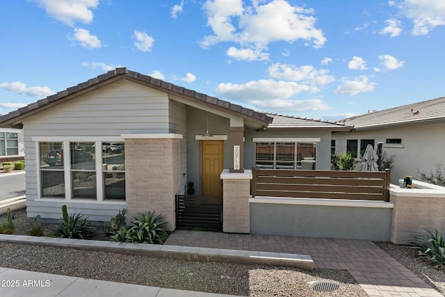 view of front of house featuring a tile roof