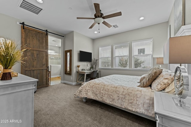 bedroom with recessed lighting, a barn door, visible vents, and light colored carpet