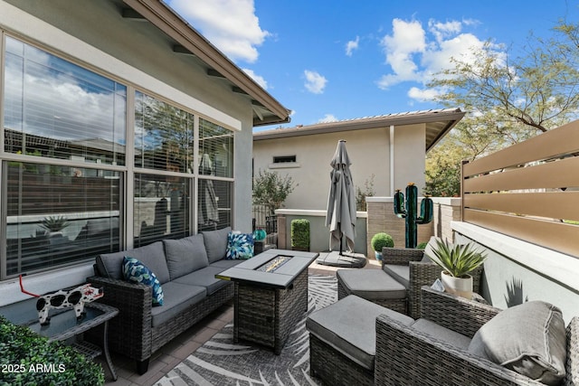 exterior space with an outdoor living space with a fire pit