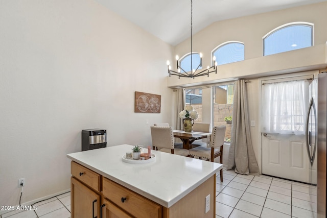 4918 W Wahalla Ln, Glendale, AZ 85308 - kitchen with freestanding refrigerator, light tile patterned floors, a chandelier, pendant lighting, and a center island