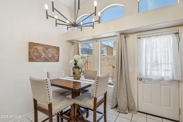 4918 W Wahalla Ln, Glendale, AZ 85308 - dining space with light tile patterned floors, a chandelier, and a towering ceiling