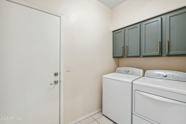 4918 W Wahalla Ln, Glendale, AZ 85308 - washroom featuring cabinet space, washing machine and dryer, and light tile patterned flooring