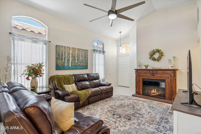 4918 W Wahalla Ln, Glendale, AZ 85308 - living room with ceiling fan, healthy amount of natural light, a glass covered fireplace, and high vaulted ceiling