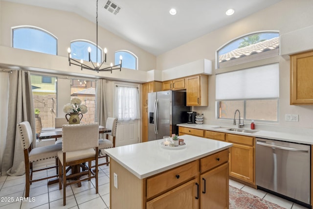 4918 W Wahalla Ln, Glendale, AZ 85308 - kitchen with appliances with stainless steel finishes, lofted ceiling, light tile patterned floors, light countertops, and a chandelier