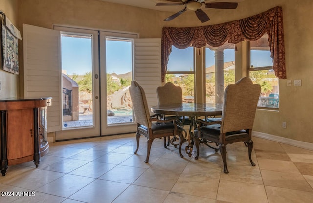 dining space with light tile patterned floors, french doors, a wealth of natural light, and ceiling fan