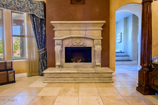 sitting room featuring a high end fireplace