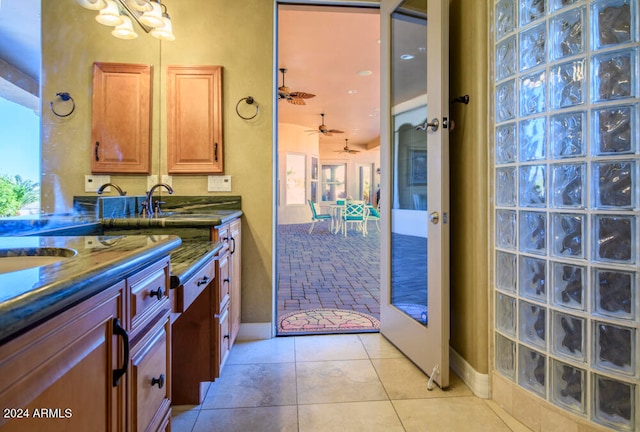 bathroom featuring tile patterned floors, ceiling fan, sink, and french doors