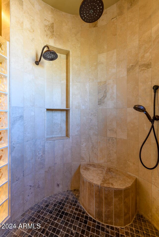 bathroom featuring tiled shower