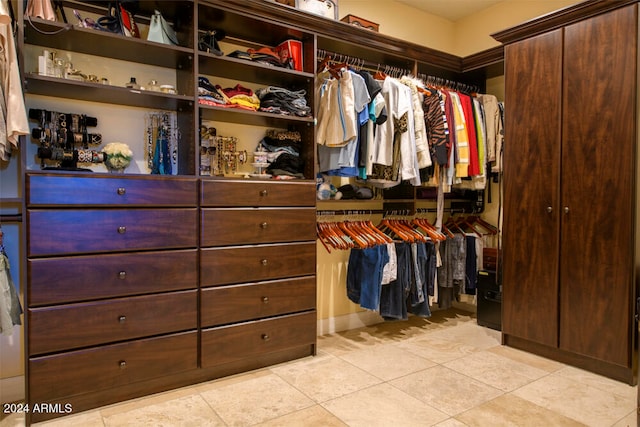 walk in closet featuring light tile patterned floors