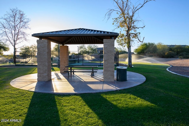 view of property's community featuring a gazebo and a lawn