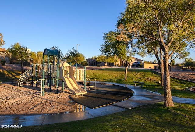 view of jungle gym featuring a lawn