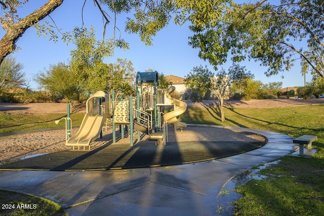 view of jungle gym featuring a lawn