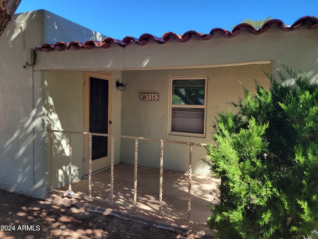 property entrance with a patio area