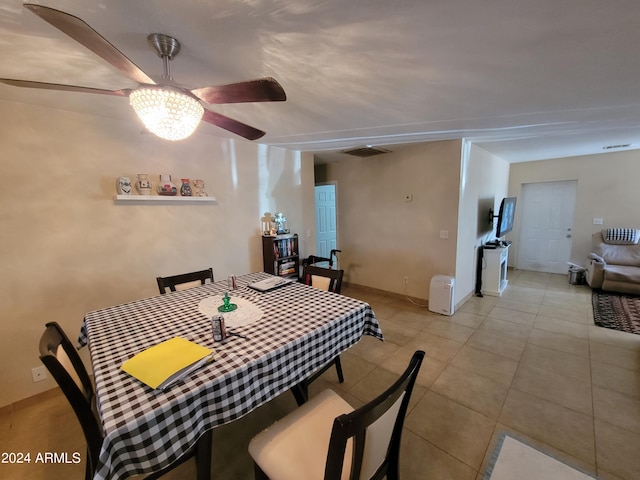 dining room with light tile patterned flooring and ceiling fan