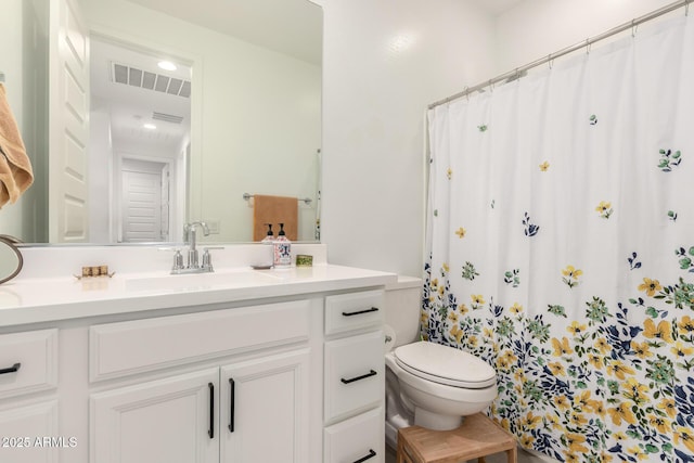 12505 W Kaler Dr, Glendale, AZ 85307 - bathroom with toilet, vanity, and recessed lighting
