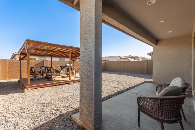 12505 W Kaler Dr, Glendale, AZ 85307 - fenced backyard featuring a wooden deck, a patio area, and a grill