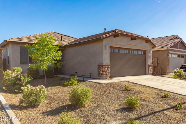 12505 W Kaler Dr, Glendale, AZ 85307 - view of front of home with a garage, driveway, stucco siding, and a tile roof