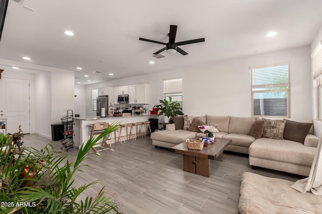 12505 W Kaler Dr, Glendale, AZ 85307 - living area featuring ceiling fan, recessed lighting, and plenty of natural light