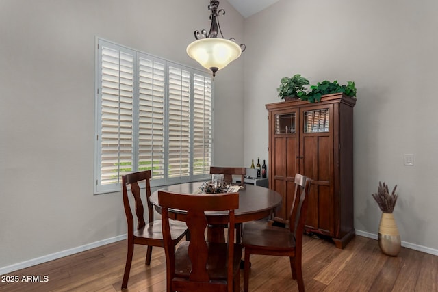 23813 S Pleasant Way, Sun Lakes, AZ 85248 - dining room with baseboards, lofted ceiling, and light wood-style floors