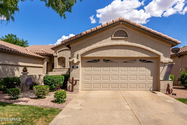 23813 S Pleasant Way, Sun Lakes, AZ 85248 - mediterranean / spanish-style home featuring an attached garage, stucco siding, driveway, and a tile roof