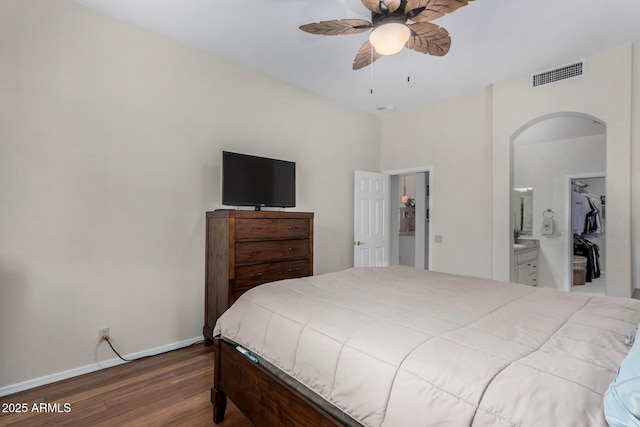 23813 S Pleasant Way, Sun Lakes, AZ 85248 - bedroom with arched walkways, a ceiling fan, baseboards, wood finished floors, and visible vents