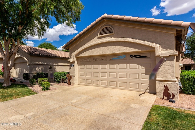 23813 S Pleasant Way, Sun Lakes, AZ 85248 - mediterranean / spanish home with an attached garage, stucco siding, a tiled roof, and concrete driveway