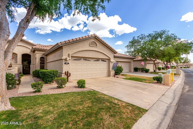 23813 S Pleasant Way, Sun Lakes, AZ 85248 - mediterranean / spanish-style house with an attached garage, stucco siding, a front yard, a tiled roof, and driveway