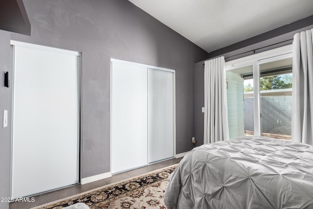 bedroom featuring lofted ceiling